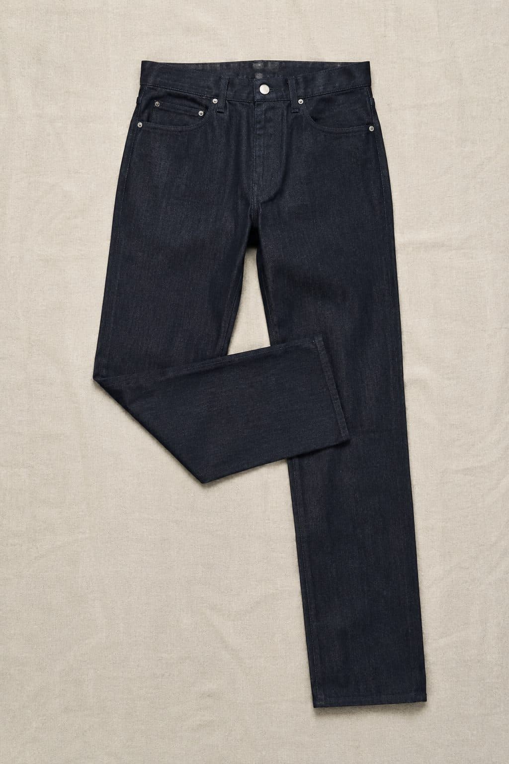Raw Slim 13oz, laid flat on linen